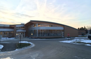 Northern Maine Community College, Presque Isle, Maine: Custom segmented curtainwall, structural sealant glazed curtain wall with custom corner, operable windows, decorative glass.