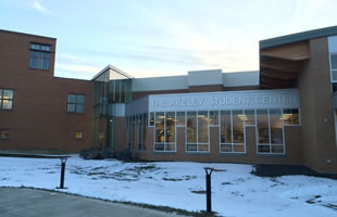 Northern Maine Community College, Presque Isle, Maine: Custom segmented curtainwall, structural sealant glazed curtain wall with custom corner, operable windows, decorative glass.