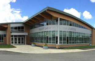 Northern Maine Community College, Presque Isle, Maine: Custom segmented curtainwall, structural sealant glazed curtain wall with custom corner, operable windows, decorative glass.